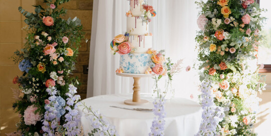 wedding cake fun candy land pretty florals arch south lodge